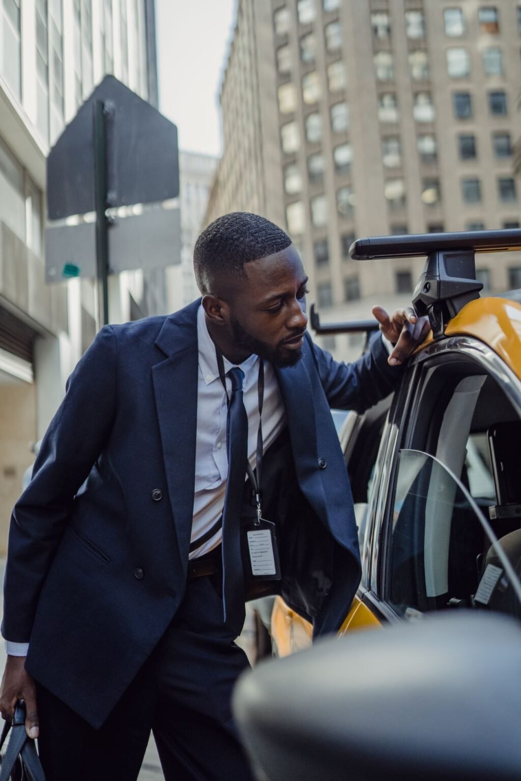 A business owner walking through a city business district